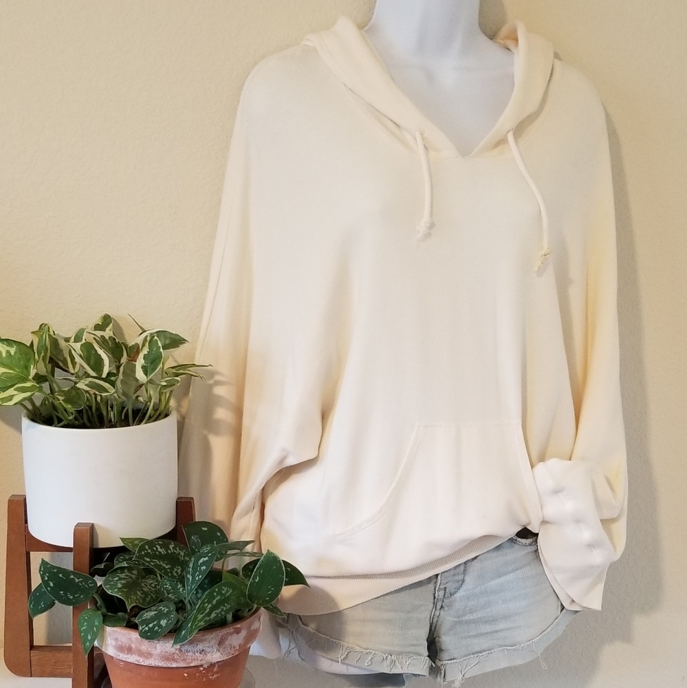 Slouchy cream hoodie with wide sleeves